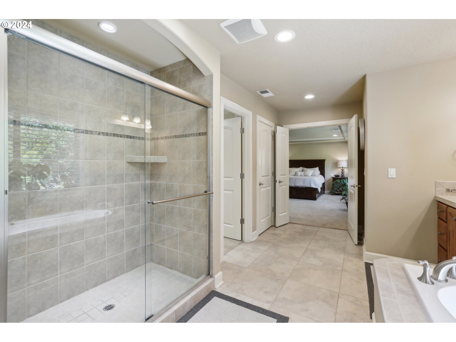 7885 Southwest Daybreak Street Wilsonville, OR 97070 - Photo 26 of 48 a bathroom with a glass shower door