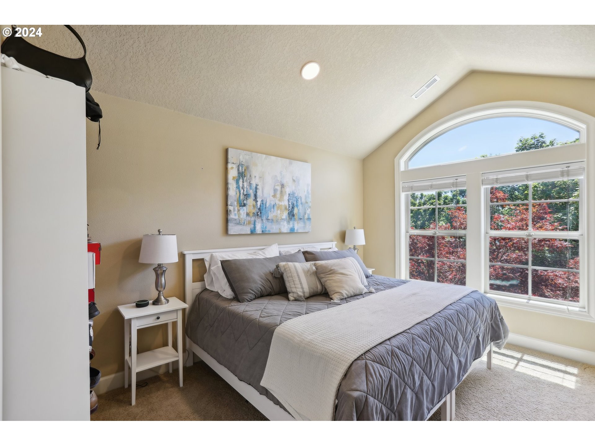 7885 Southwest Daybreak Street Wilsonville, OR 97070 - Photo 27 of 48 a bedroom with a large bed and a window