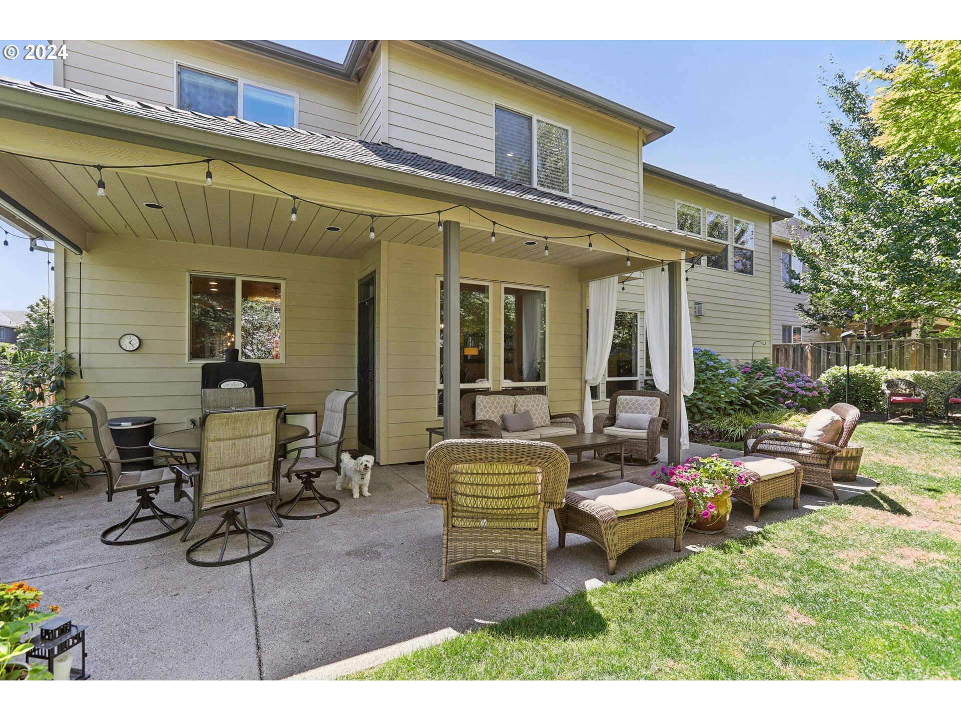 7885 Southwest Daybreak Street Wilsonville, OR 97070 - Photo 40 of 48 a view of a patio with couches table and chairs