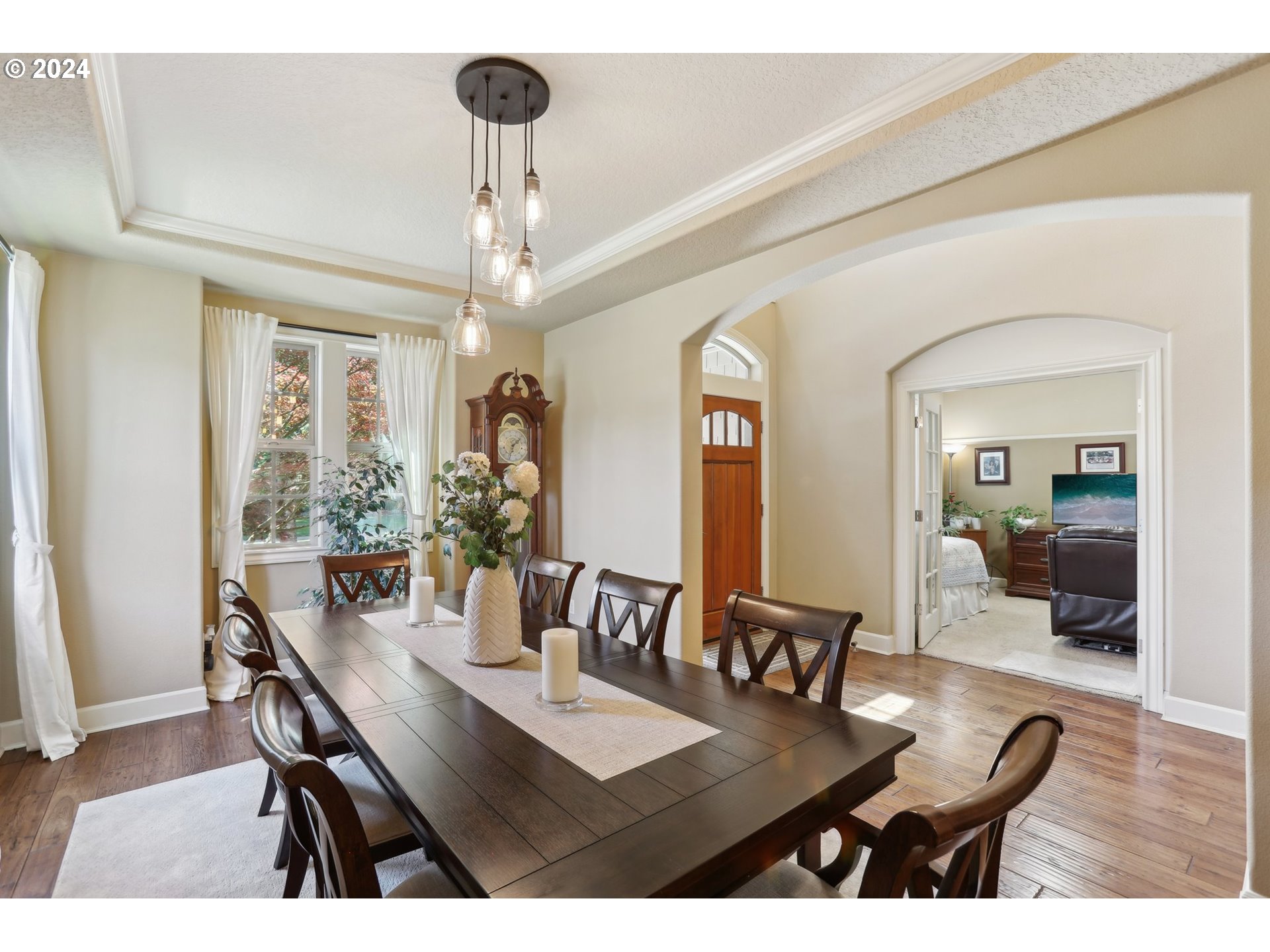 7885 Southwest Daybreak Street Wilsonville, OR 97070 - Photo 4 of 48 a view of a dining room with furniture and wooden floor