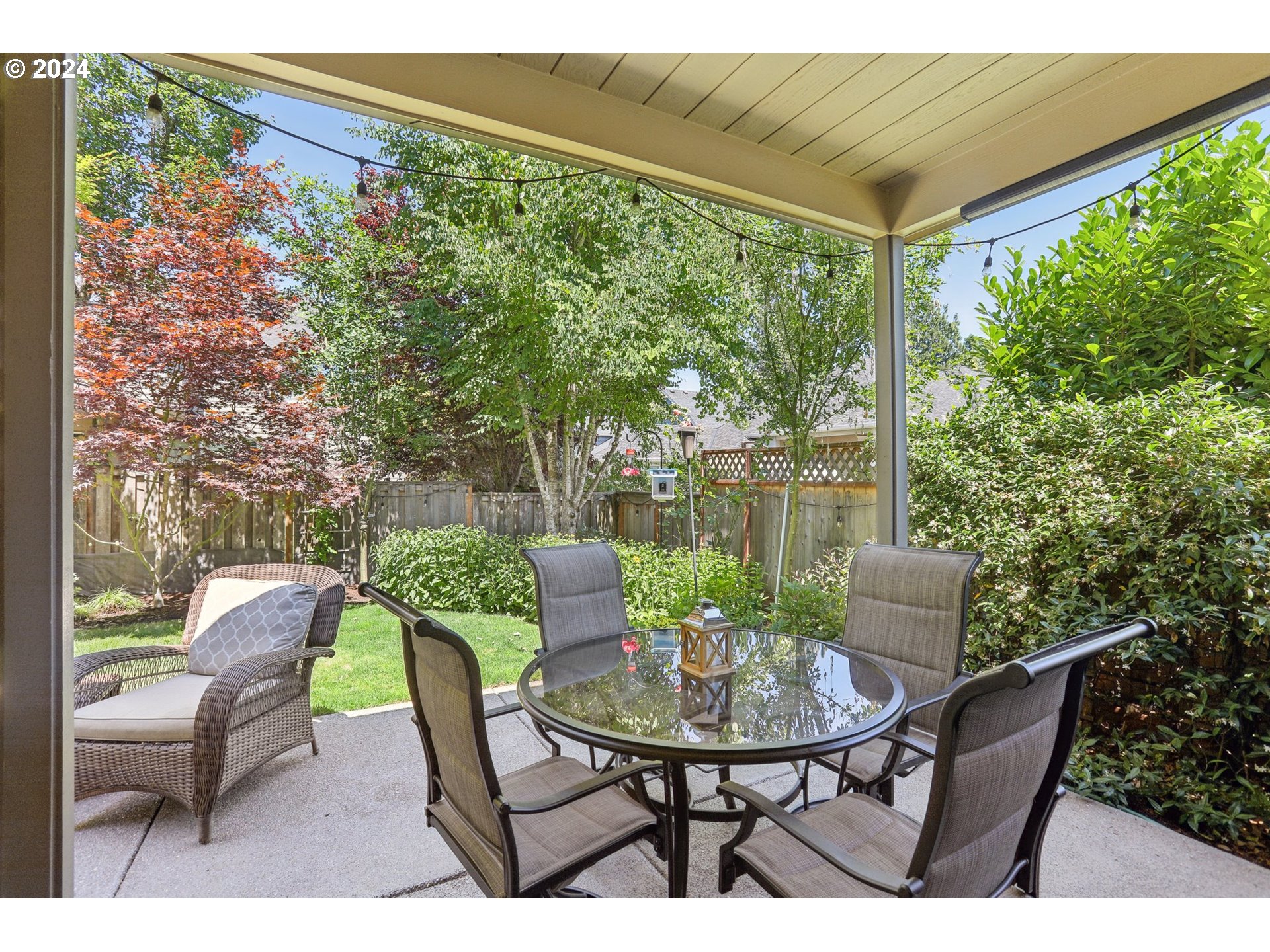 7885 Southwest Daybreak Street Wilsonville, OR 97070 - Photo 42 of 48 a view of a patio with a table and chairs