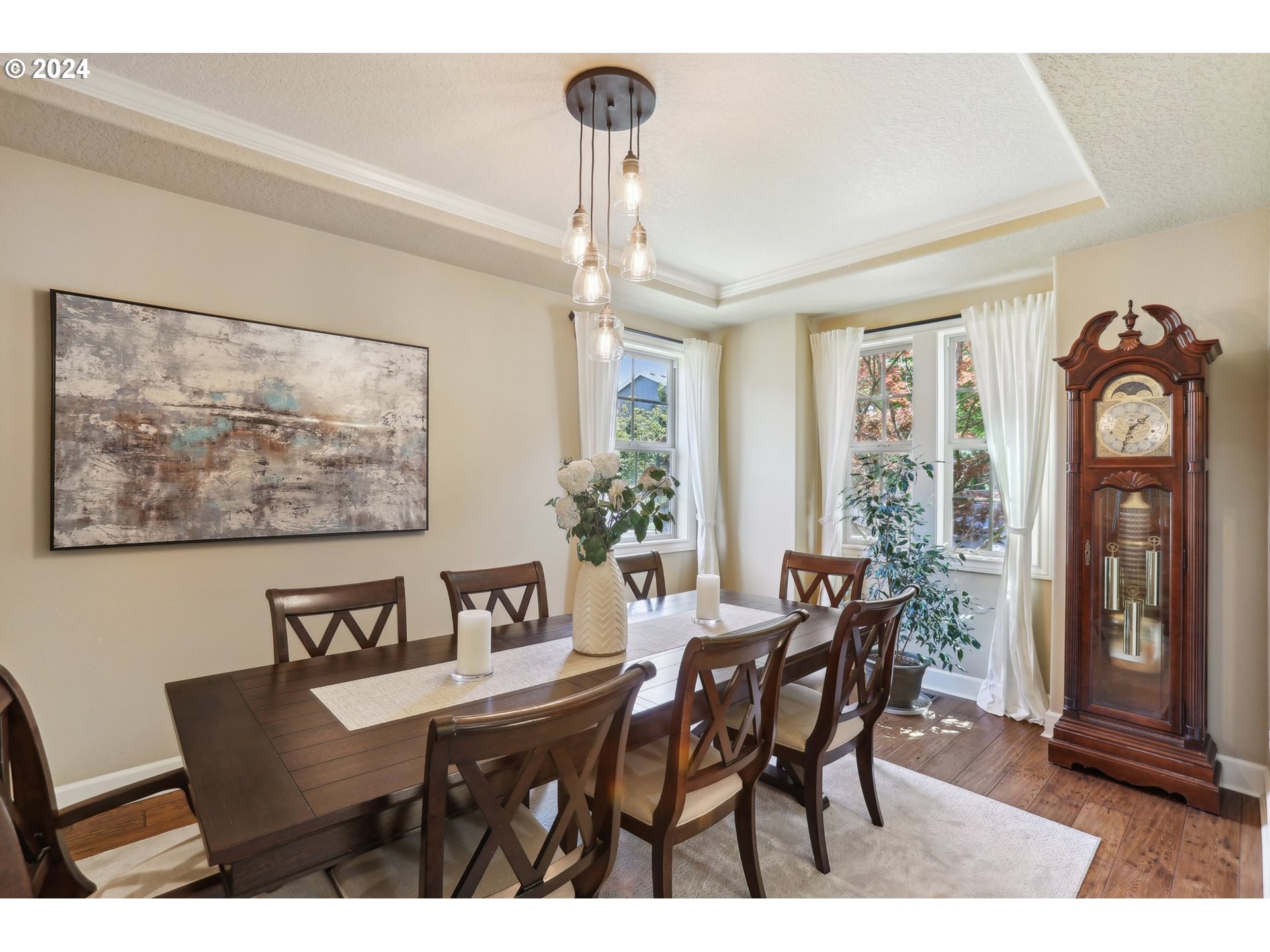 7885 Southwest Daybreak Street Wilsonville, OR 97070 - Photo 6 of 48 a view of a dining room with furniture window and wooden floor