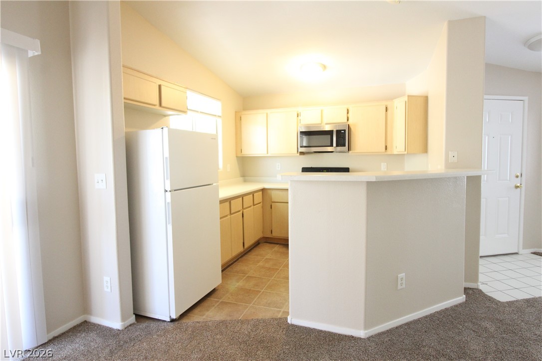 1881 West Alexander Road, Unit 2068 North Las Vegas, NV 89032 - Photo 8 of 22 KITCHEN W/ BREAKFAST BAR