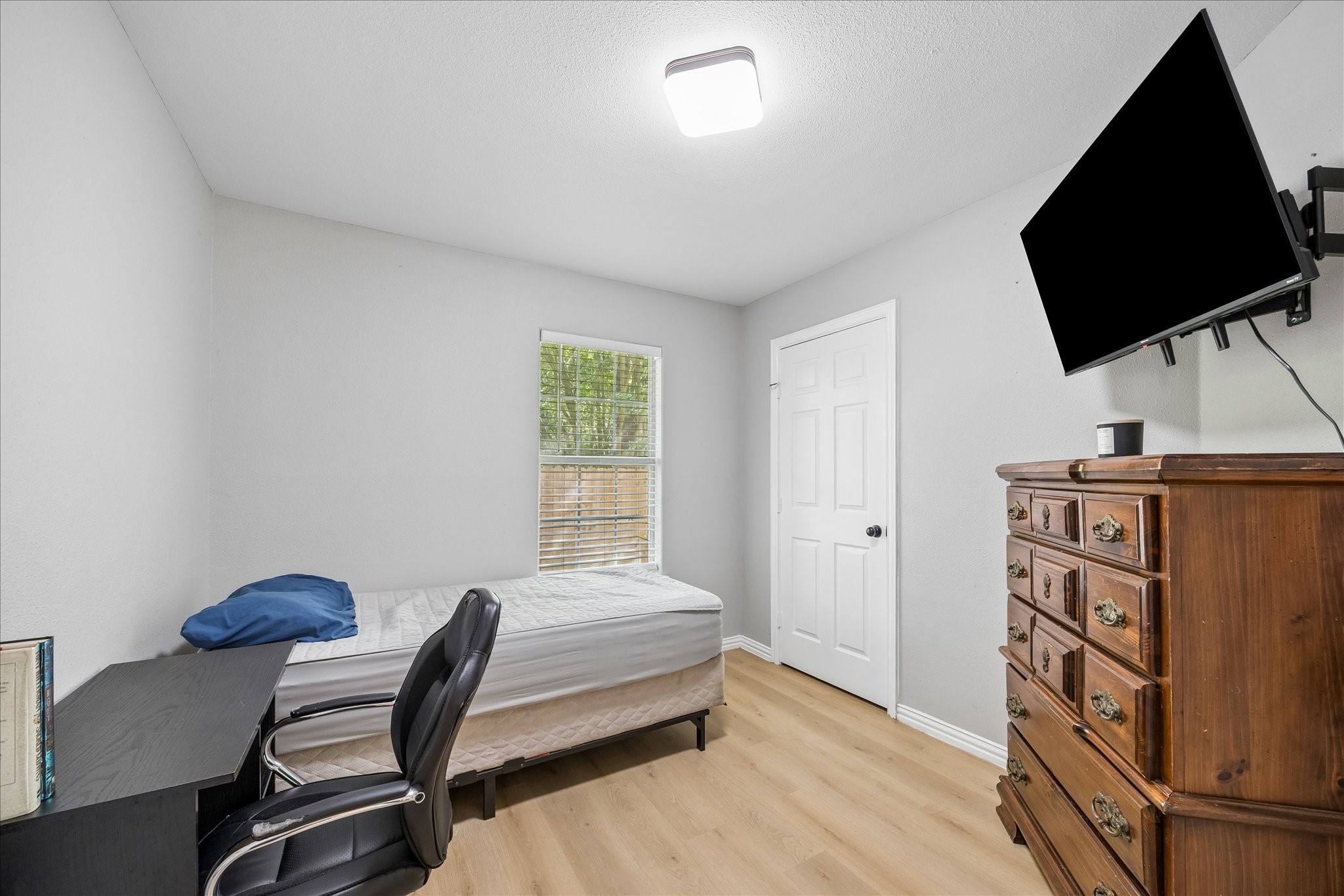 539 Anderson Street Sealy, TX 77474 - Photo 15 of 19 This room is compact and functional with a window for natural light and wood flooring. Perfect as a guest room or home office.