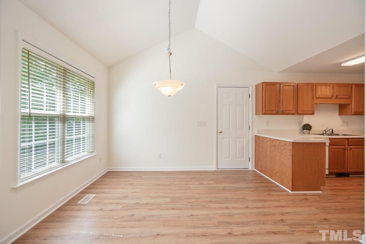 616 Rookwood Court Wake Forest, NC 27587 - Photo 15 of 30 a view of kitchen and wooden floor