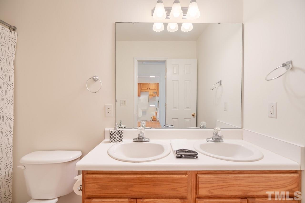 616 Rookwood Court Wake Forest, NC 27587 - Photo 24 of 30 a bathroom with a sink and a toilet