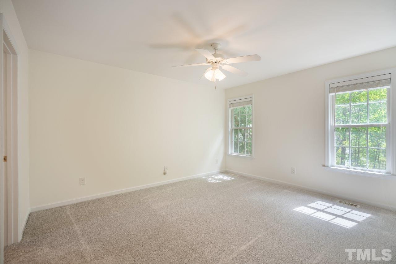 616 Rookwood Court Wake Forest, NC 27587 - Photo 25 of 30 an empty room with windows and fan
