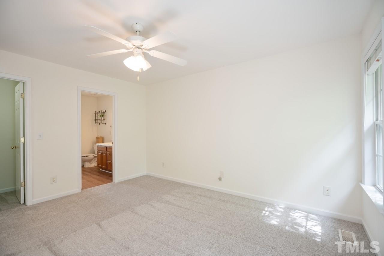 616 Rookwood Court Wake Forest, NC 27587 - Photo 28 of 30 a view of a livingroom with a ceiling fan and window