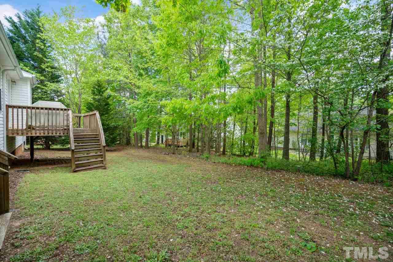 616 Rookwood Court Wake Forest, NC 27587 - Photo 6 of 30 a view of a deck with a trees