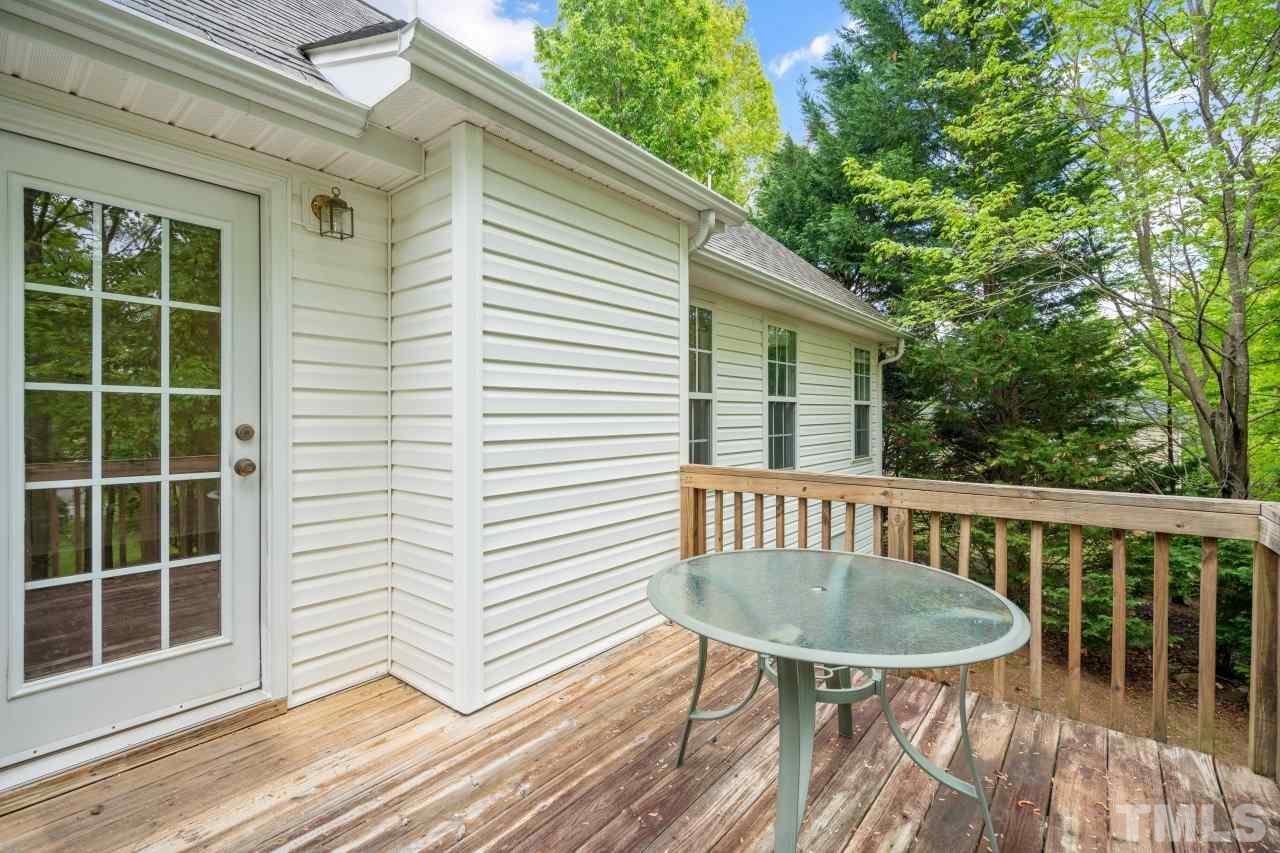 616 Rookwood Court Wake Forest, NC 27587 - Photo 8 of 30 a view of a chair and table on the deck