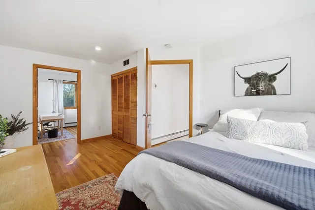 a bedroom with a bed and a couch