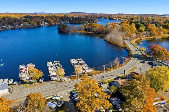an aerial view of a house with a ocean view