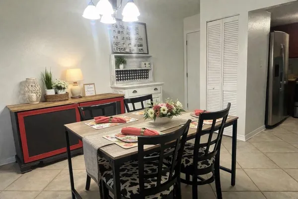 a dining room with furniture and window