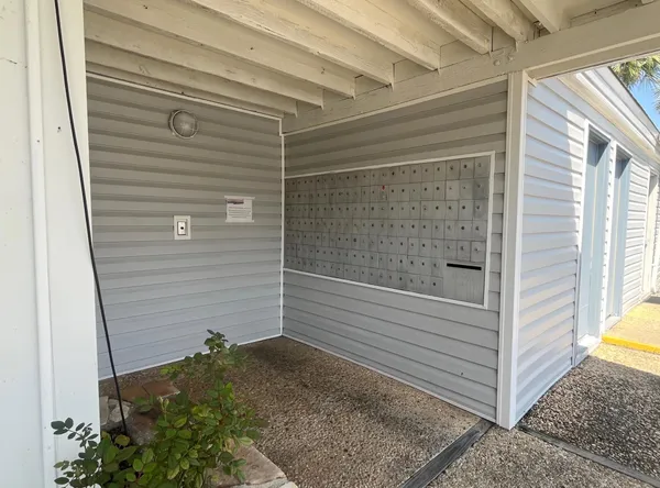a view of a backyard with sitting area