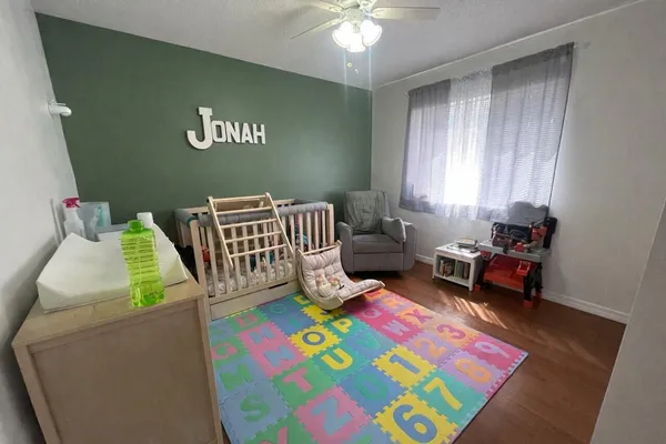 a living room with furniture and a rug