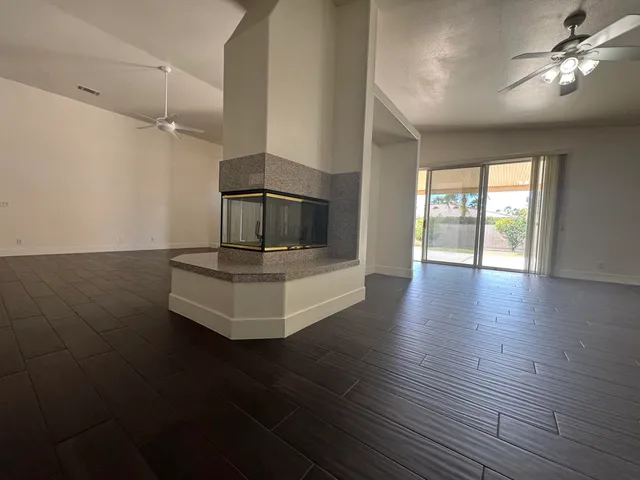a view of a living room and wooden floor