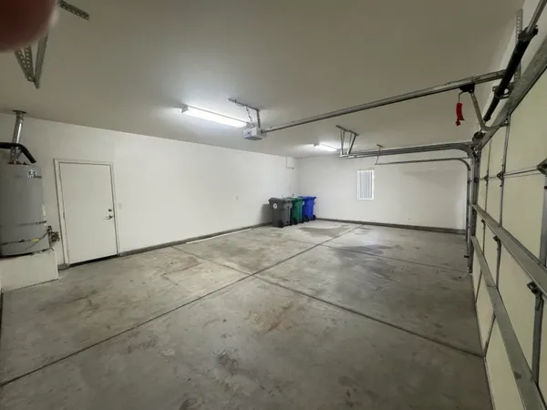 a spacious bathroom with a double vanity sink a mirror and shower