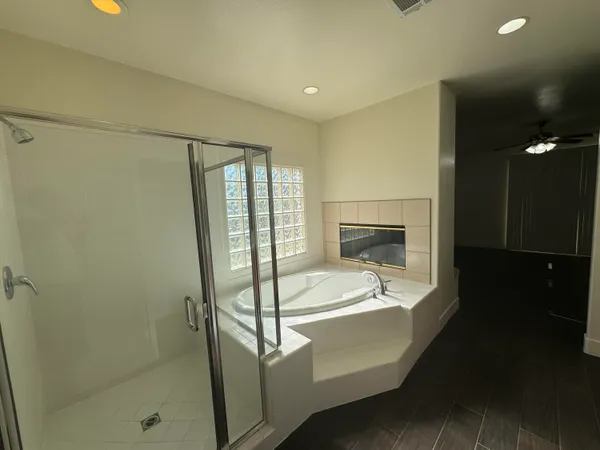 a view of a living room and wooden floor