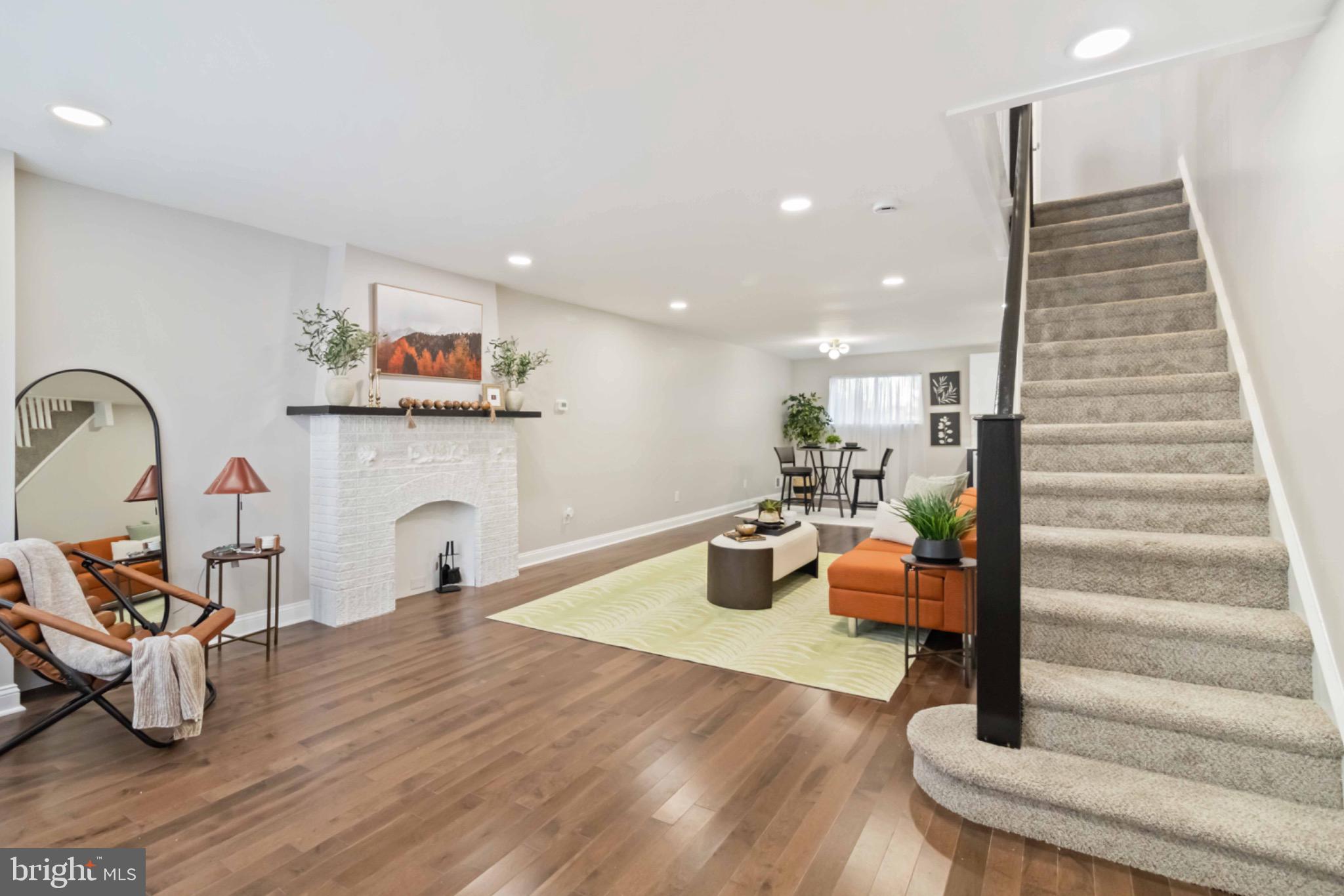 7724 Fayette Street Philadelphia, PA 19150 - Photo 2 of 33 a living room with furniture and a fireplace