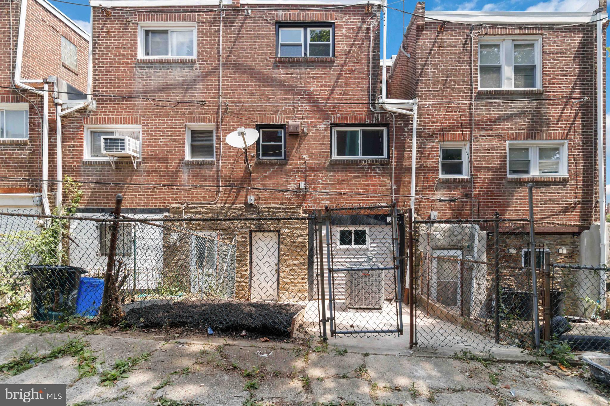 7724 Fayette Street Philadelphia, PA 19150 - Photo 32 of 33 a view of a brick house with many windows