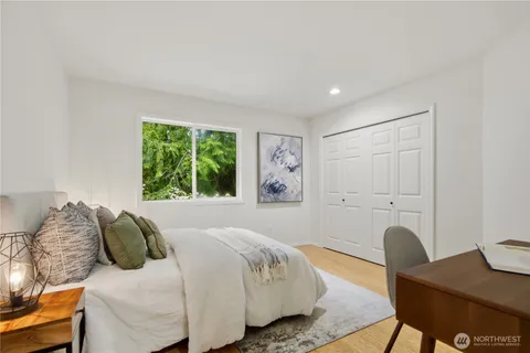 a bedroom with furniture and a window