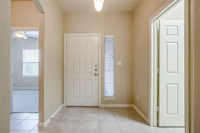 a view of a hallway with front door