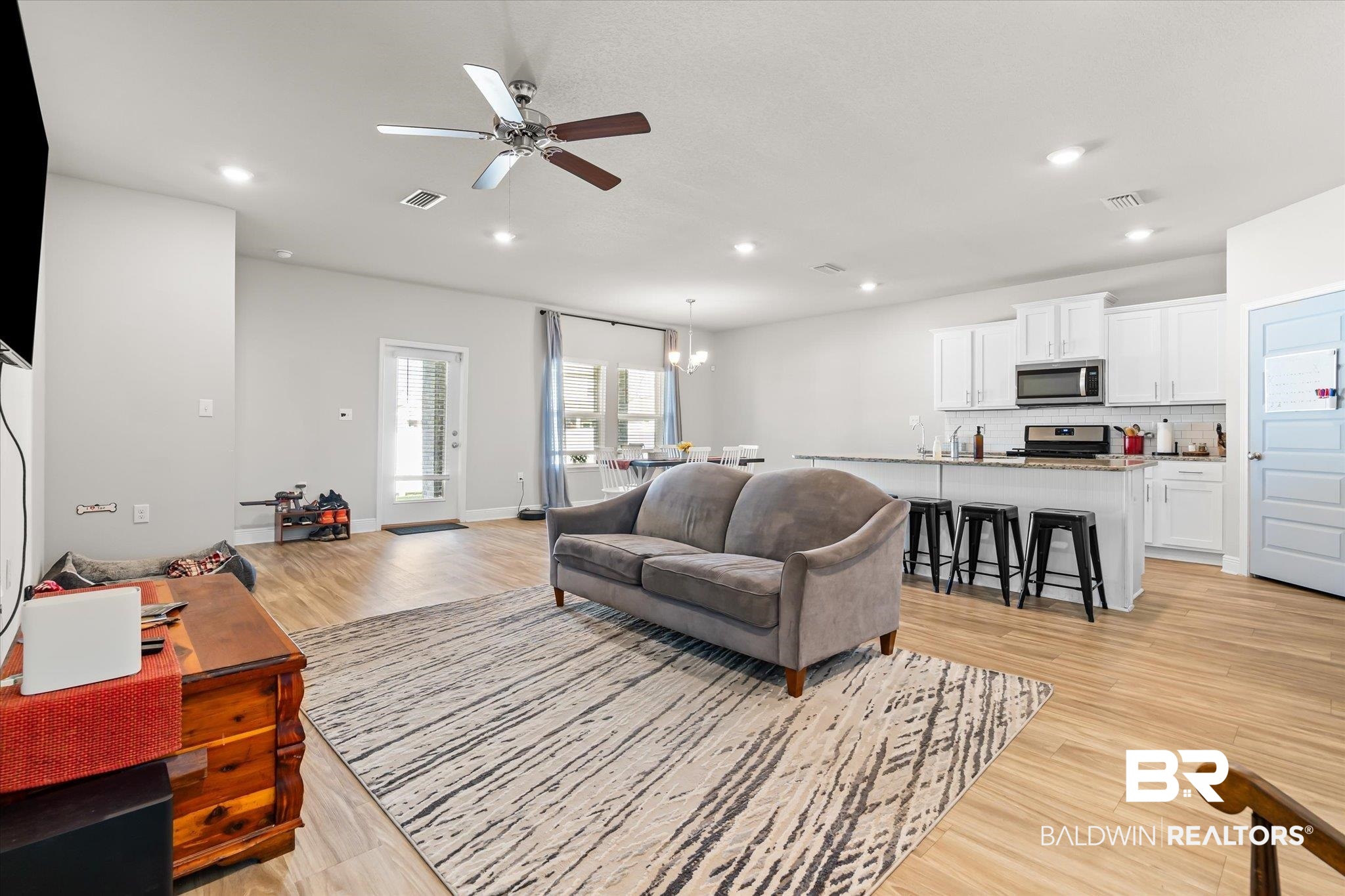 24262 Alydar Loop Daphne, AL 36526 - Photo 6 of 33 Living area featuring recessed lighting, visible vents, and light wood-style flooring