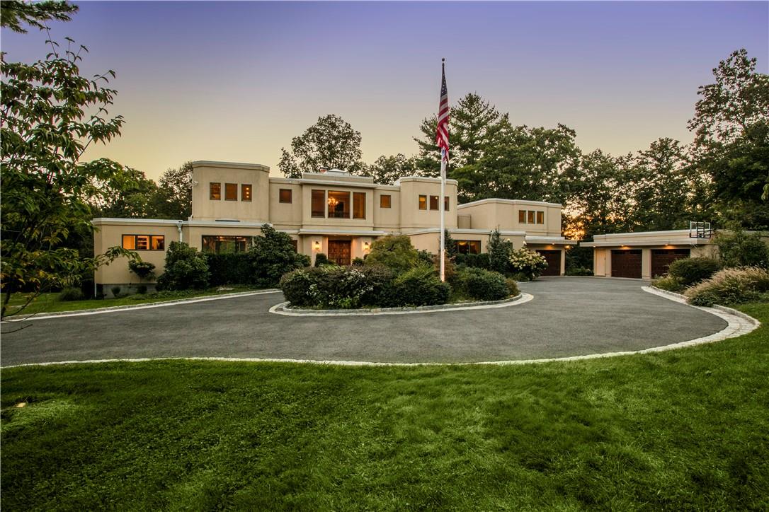 Mid-Century Modern Exterior with Transitional Flow Interior. 4- Car Garage and Lush Landscaping Throughout!