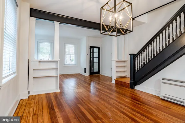 a view of an entryway with wooden floor