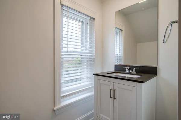 a view of a room with wooden floor and window