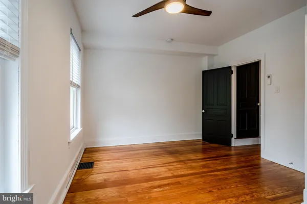 a view of a garage room with wooden walls