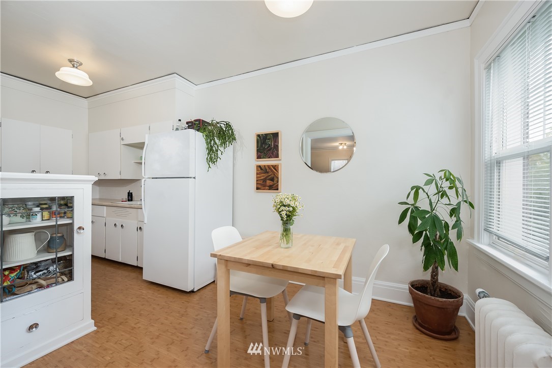 6402 Phinney Avenue North Seattle, WA 98103 - Photo 14 of 17 a dining room with furniture and window
