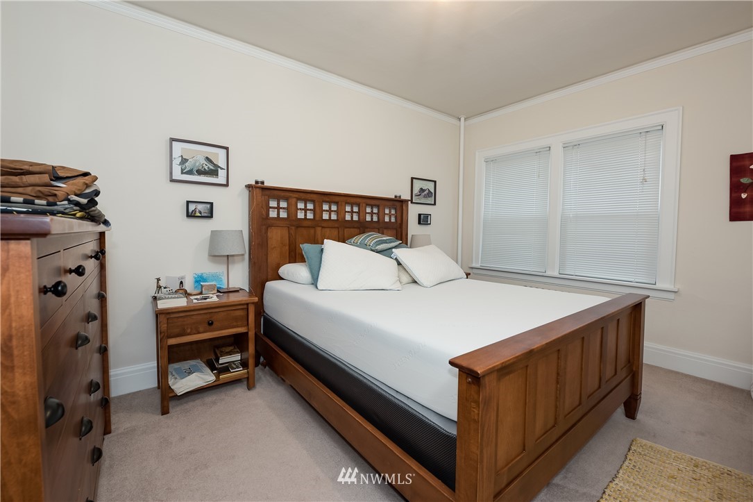 6402 Phinney Avenue North Seattle, WA 98103 - Photo 17 of 17 a bedroom with a bed and a window