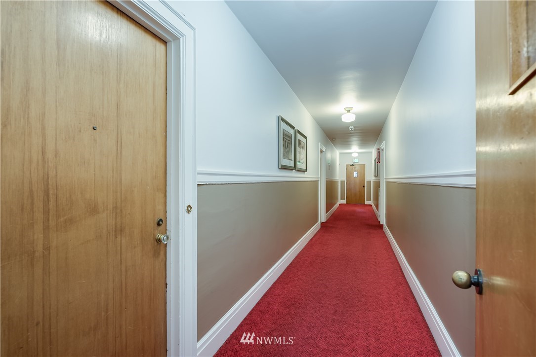 6402 Phinney Avenue North Seattle, WA 98103 - Photo 5 of 17 a view of entryway and hall with wooden floor