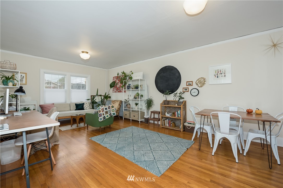 6402 Phinney Avenue North Seattle, WA 98103 - Photo 8 of 17 a living room with furniture and wooden floor