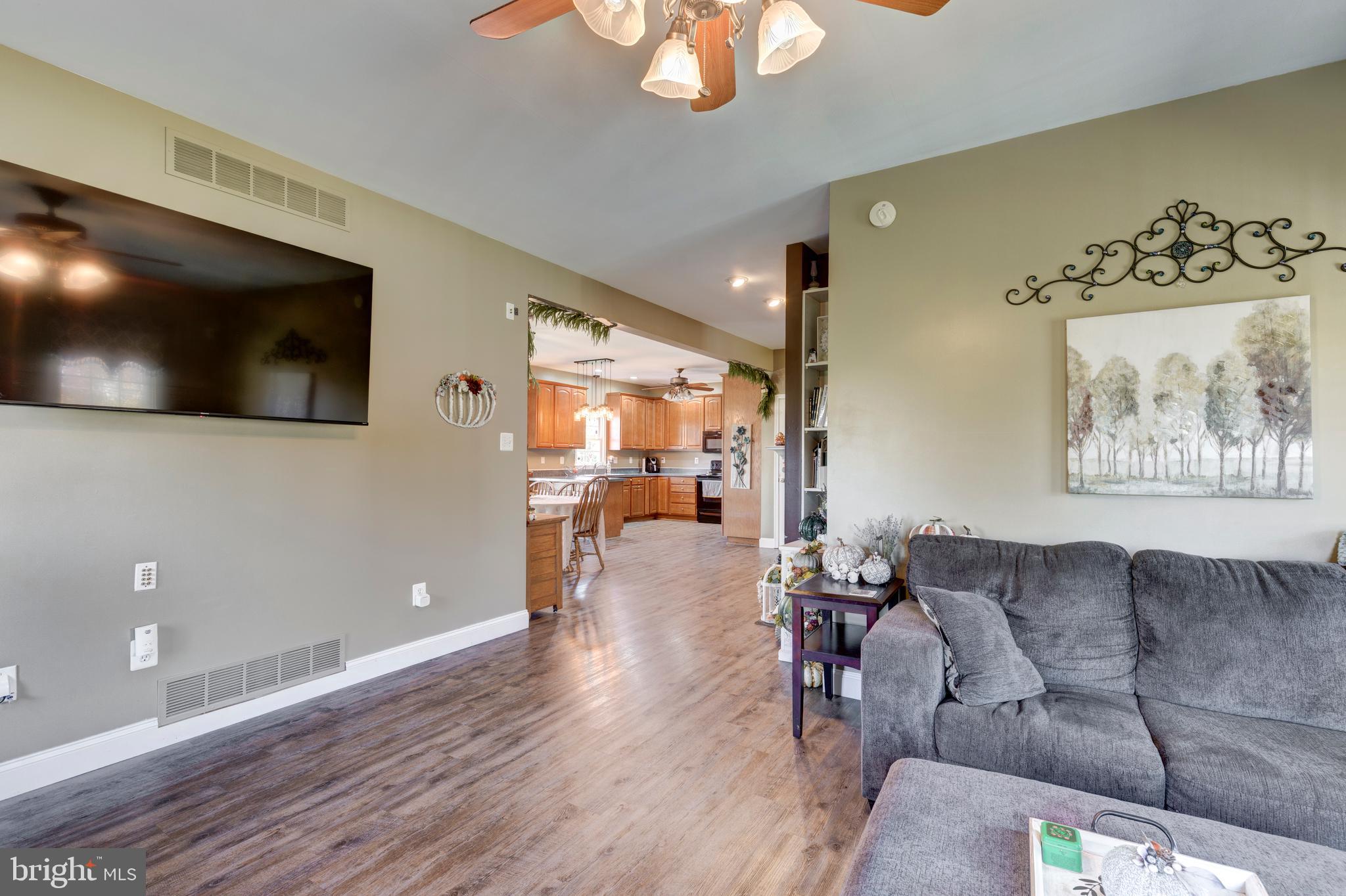 128 Pine Grove Road Hanover, PA 17331 - Photo 23 of 93 a living room with couches and a flat screen tv