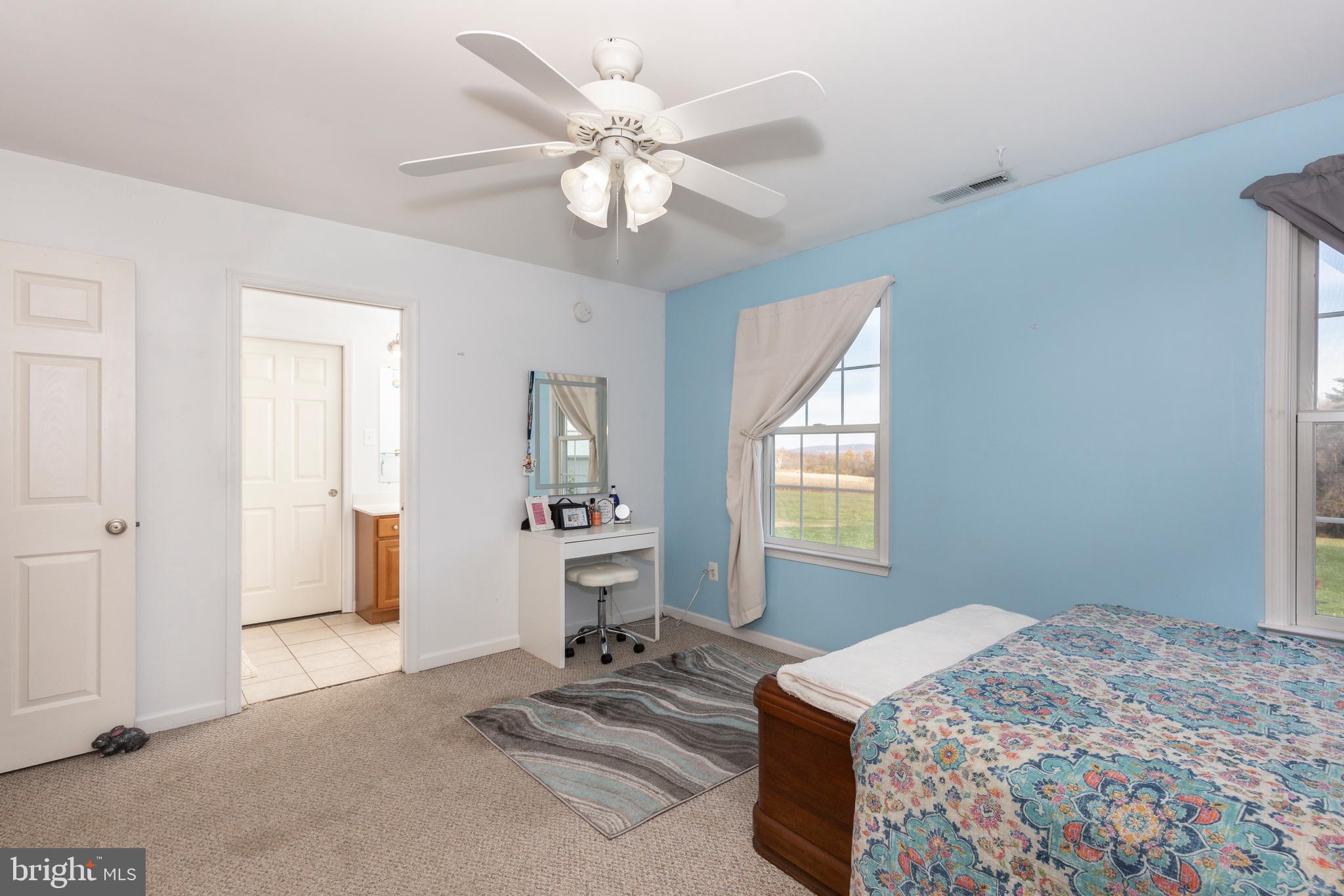 128 Pine Grove Road Hanover, PA 17331 - Photo 35 of 93 a bedroom with a bed and a chandelier