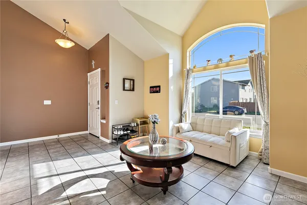 a living room with a couch and a table