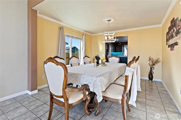 a dining room with furniture and window