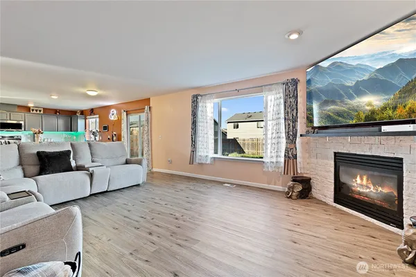 a view of a living room a window and a fireplace