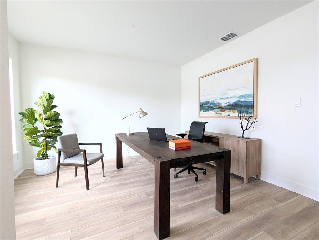 3786 Wenatche Drive Dallas, TX 75233 - Photo 3 of 16 a view of a workspace with furniture and wooden floor