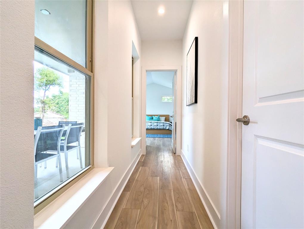 3786 Wenatche Drive Dallas, TX 75233 - Photo 9 of 16 a view of a hallway with wooden floor and staircase