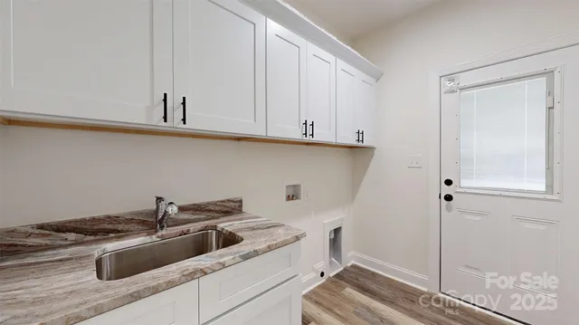a kitchen with a sink and cabinets