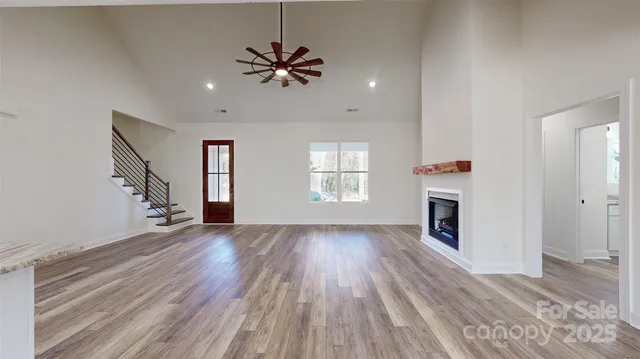 wooden floor in an empty room with a fireplace
