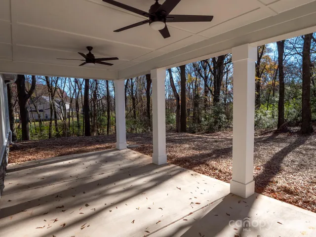 a view of a room with wooden floor and a porch