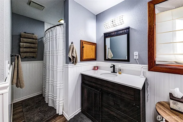 a bathroom with a sink and a mirror