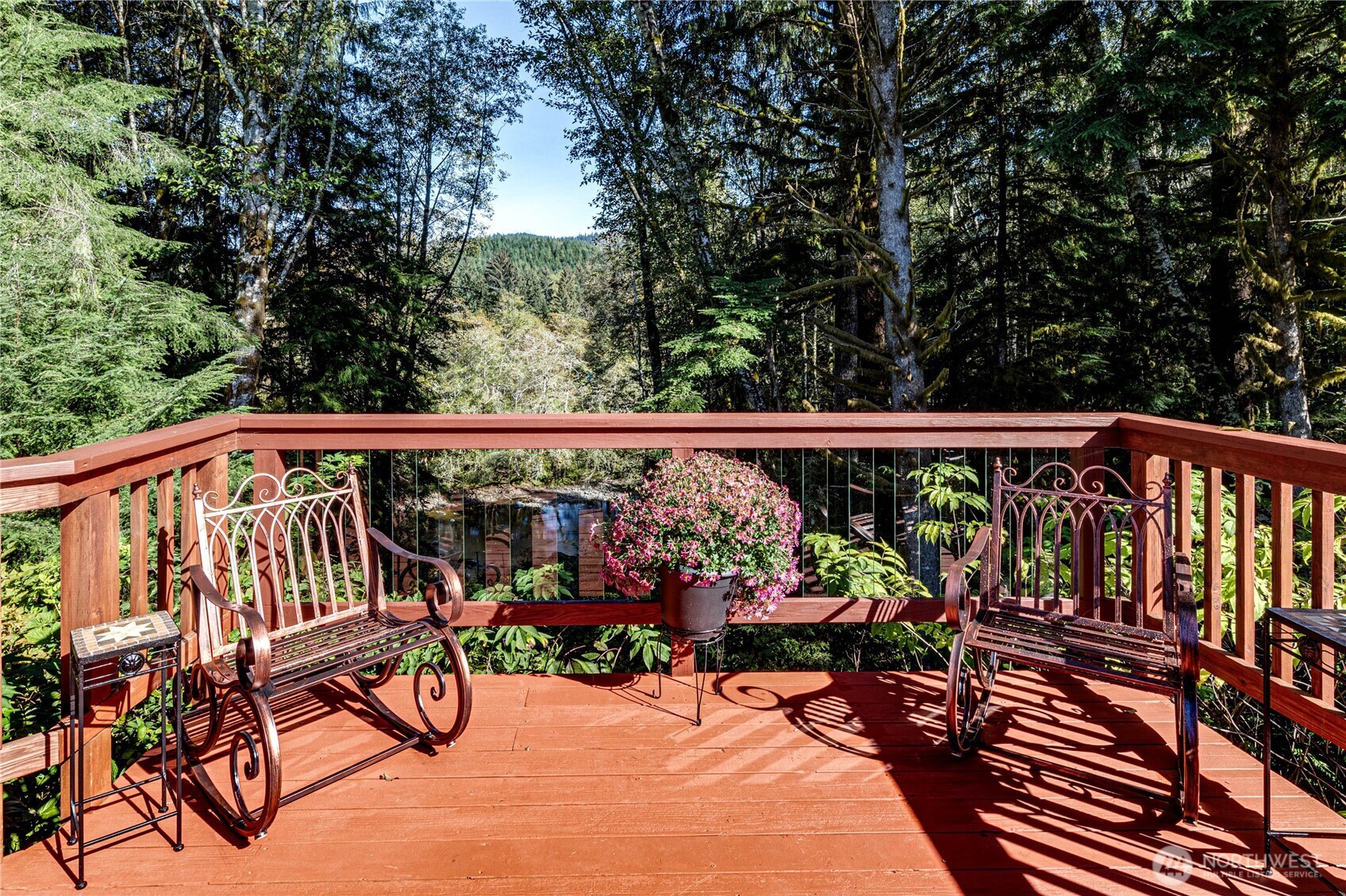 107 Dowan Creek Road Forks, WA 98331 - Photo 24 of 40 a view of a chairs and tables in the balcony
