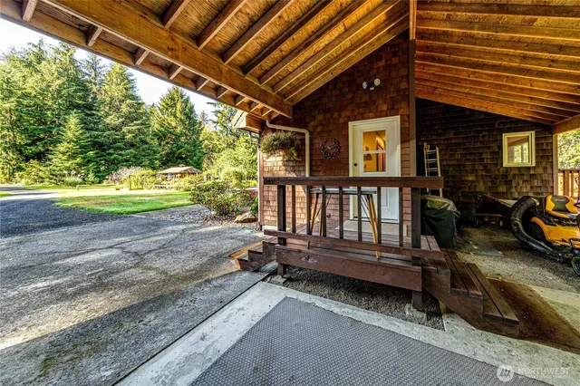 a view of a backyard with sitting area