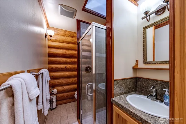 a bathroom with a sink and mirror