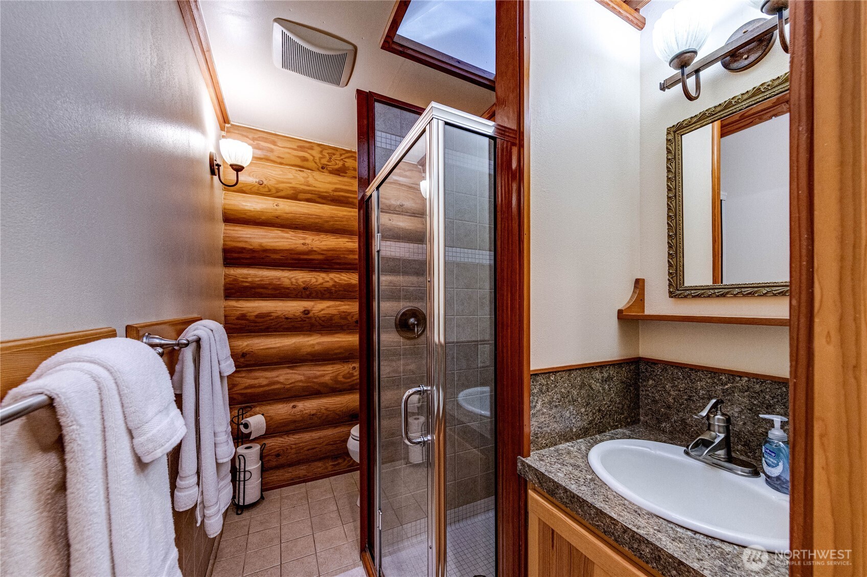 107 Dowan Creek Road Forks, WA 98331 - Photo 34 of 40 a bathroom with a sink and mirror